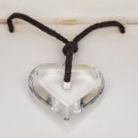 Two Baccarat glass pendants One of heart form, the other a purple cross, each boxed.
