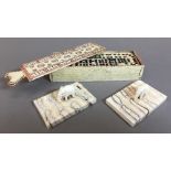 An early 19th century carved and polychrome decorated whale bone box enclosing dominoes The sliding