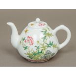 A Chinese Republic style painted porcelain teapot Decorated with butterflies amongst floral sprays,
