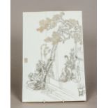 A Chinese porcelain plaque Incise decorated with figures on a terrace before a gnarled tree,