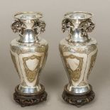 A pair of late 19th century Chinese unmarked silver and silver gilt vases Each flared neck rim