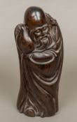 A Chinese carved rosewood figure of Shao Lao Typically modelled. 37 cm high.