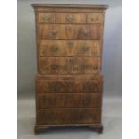 An 18th century walnut chest on chest The moulded canted rectangular top above an arrangement of