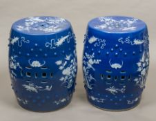 A pair of 19th century Chinese porcelain garden seats Of barrel form decorated in white with