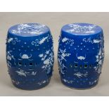 A pair of 19th century Chinese porcelain garden seats Of barrel form decorated in white with