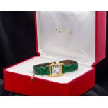 An 18 ct gold Cartier lady's wristwatch The square shaped white dial with Roman numerals inscribed