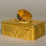 A 19th century ormolu cased singing bird box The hinged cover variously inlaid,