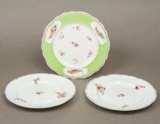 A pair of Chamberlains Worcester porcelain plates Decorated with floral sprays within moulded