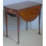 A George III mahogany crossbanded Pembroke table The oval twin flap top above the end frieze drawer,