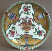 A Chinese porcelain dished plate, probab
