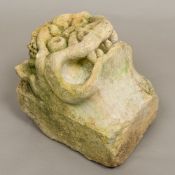 A carved limestone gargoyle Typically modelled. 31 cm high.