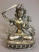 A Sino-Tibetan white metal deity