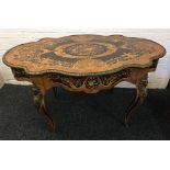A 19th century ormolu mounted marquetry inlaid centre table The cast ormolu banded shaped top