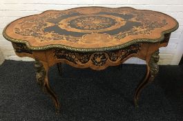 A 19th century ormolu mounted marquetry inlaid centre table The cast ormolu banded shaped top