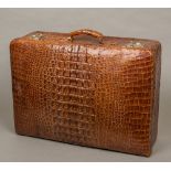 A vintage crocodile skin suitcase