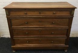 A 19th century French walnut commode The cleated rectangular moulded top above four straight