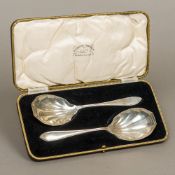 A cased pair of George V silver serving