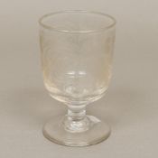 An early 19th century engraved glass rum