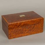 A French amboyna veneered humidor Of hinged rectangular form,