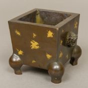 A Chinese patinated bronze "gold splash"