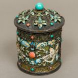 A Chinese silver enamel decorated lidded box The domed removable lid enclosing the jade interior,