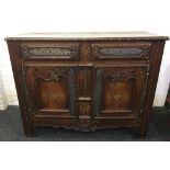 An 18th century French polished steel and brass mounted inlaid chestnut buffet The moulded