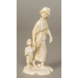 A late 19th/early 20th century Japanese carved ivory okimono Worked as a woman in traditional