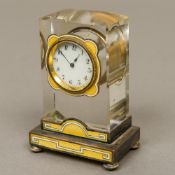 A Continental silver and enamel decorated crystal desk clock The white enamelled dial with Arabic