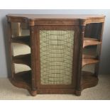 A Regency rosewood side cabinet The shaped top above the brass grille centred cupboard door flanked