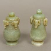 A pair of Chinese carved jade lidded vas