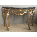 An 18th century Continental giltwood and faux marble top console table The serpentine shaped top