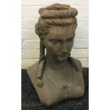 A 19th century terracotta bust Modelled as young woman with her hair in ringlets. 46 cm high.