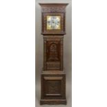 A George III oak cased eight-day longcase clock The silvered dial with Arabic and Roman numerals