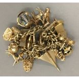A 9 ct gold charm bracelet (125 grammes total weight)