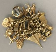 A 9 ct gold charm bracelet (125 grammes total weight)