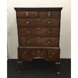 An 18th century and later walnut and elm chest on stand