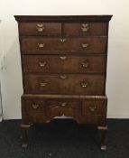 An 18th century and later walnut and elm chest on stand