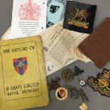 A quantity of military badges, etc.