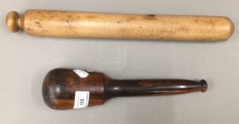 A vintage treen rolling pin and a lignum vitae pestle