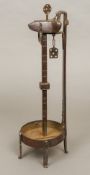 An early 19th century German/Austrian Crusie lamp, of typical burnished wrought iron form.