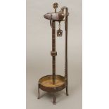 An early 19th century German/Austrian Crusie lamp, of typical burnished wrought iron form.