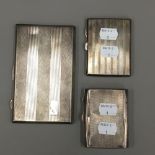 Three silver cigarette cases
