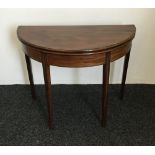 A 19th century mahogany demi-lune tea table