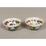 A pair of Chinese famille noir porcelain tea bowls, floral decorated,