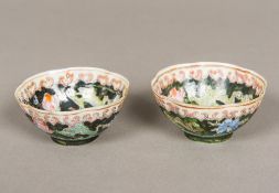 A pair of Chinese famille noir porcelain tea bowls, floral decorated,