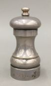 A silver pepper mill