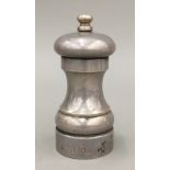 A silver pepper mill