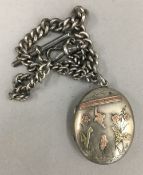 A Victorian silver locket on a silver chain