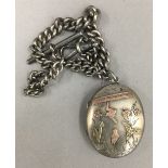 A Victorian silver locket on a silver chain