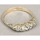 An 18 ct gold five stone diamond ring (2.